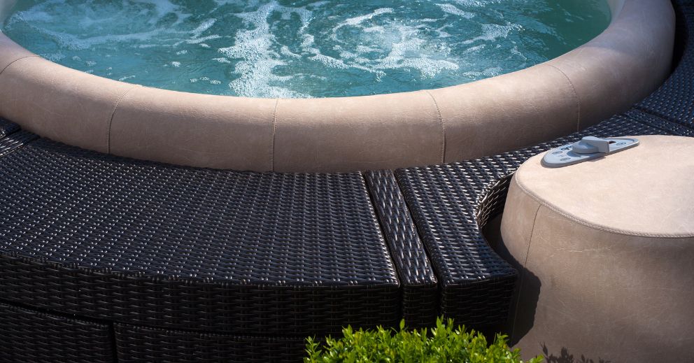 Close-up of a bubbling ice tub with wicker seating during your first ice bath session